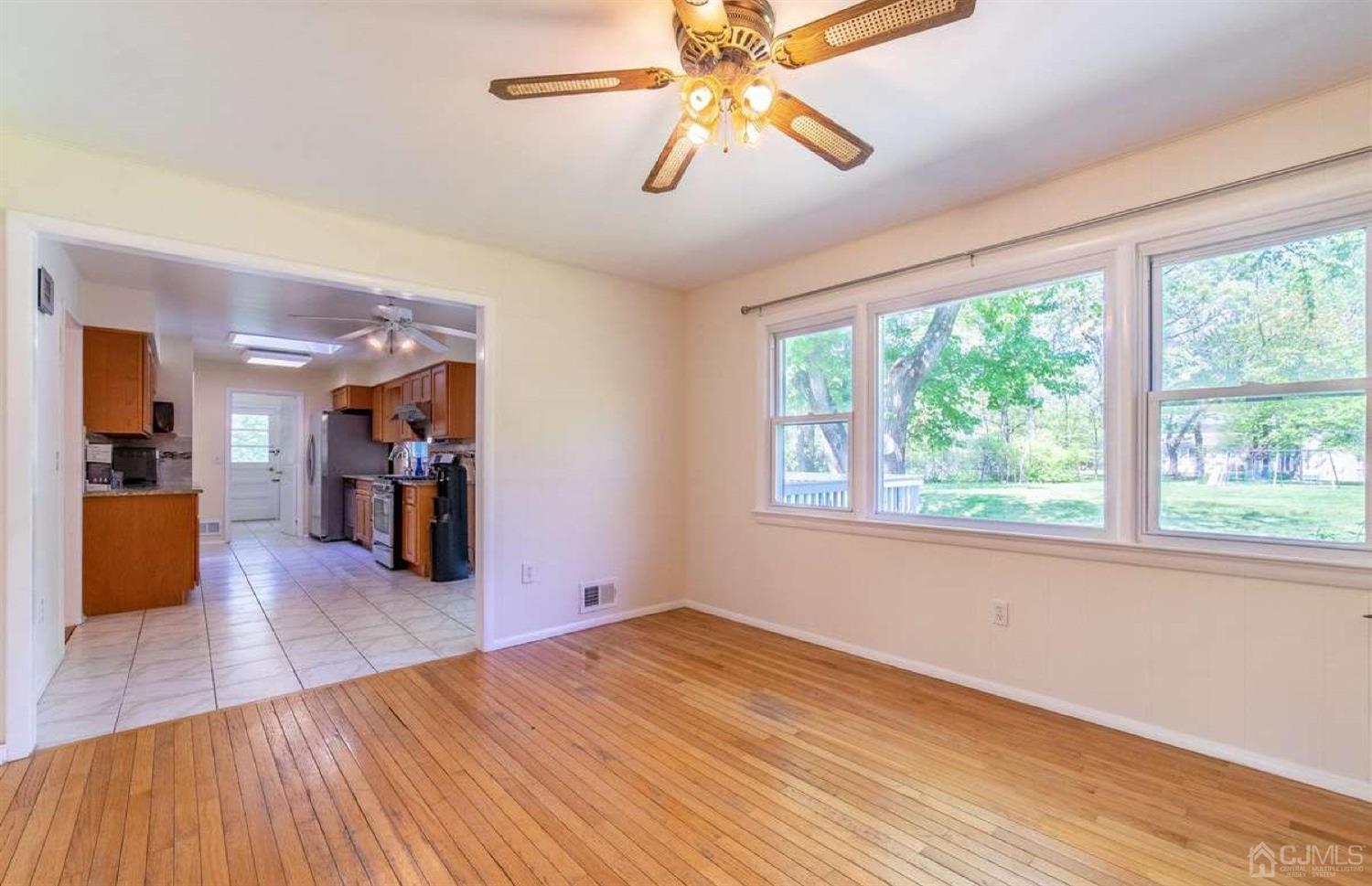 4 Devon Road Edison, NJ 08820 - Photo 14 of 35 a view of empty room with wooden floor and fan