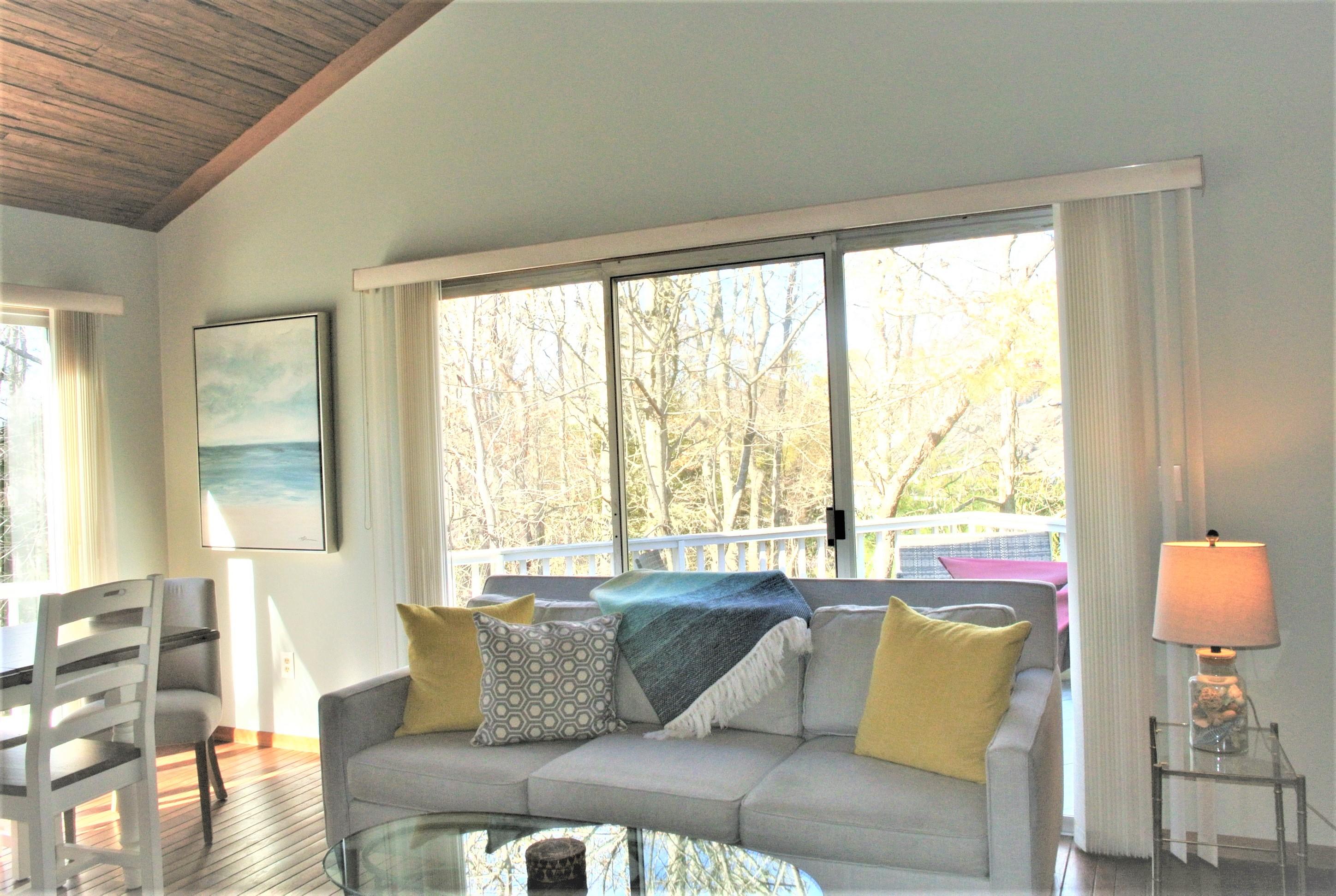 163 Greensward Road Mashpee, MA 02649 - Photo 12 of 37 a living room with furniture and a large window