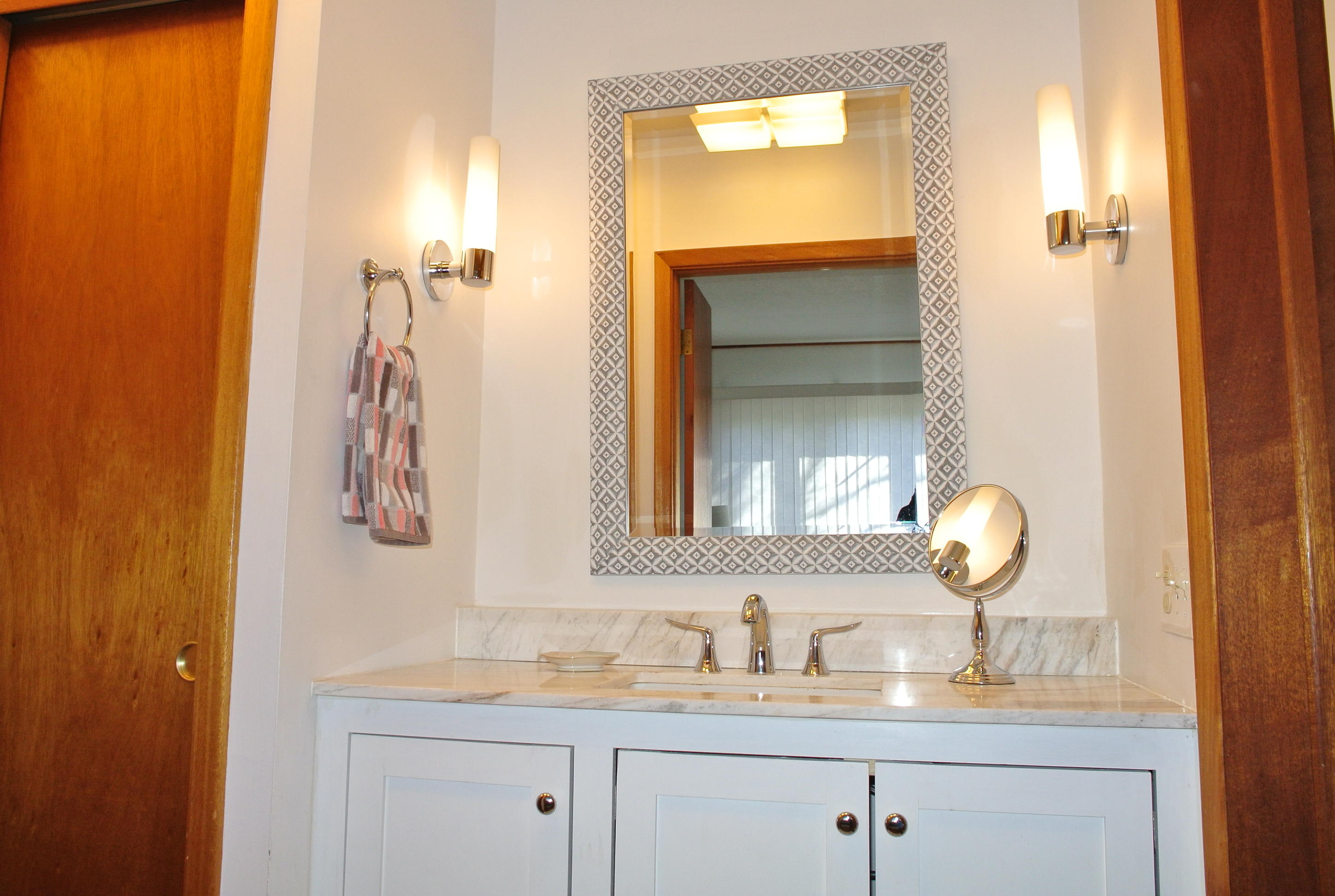 163 Greensward Road Mashpee, MA 02649 - Photo 13 of 37 a bathroom with a sink and a mirror