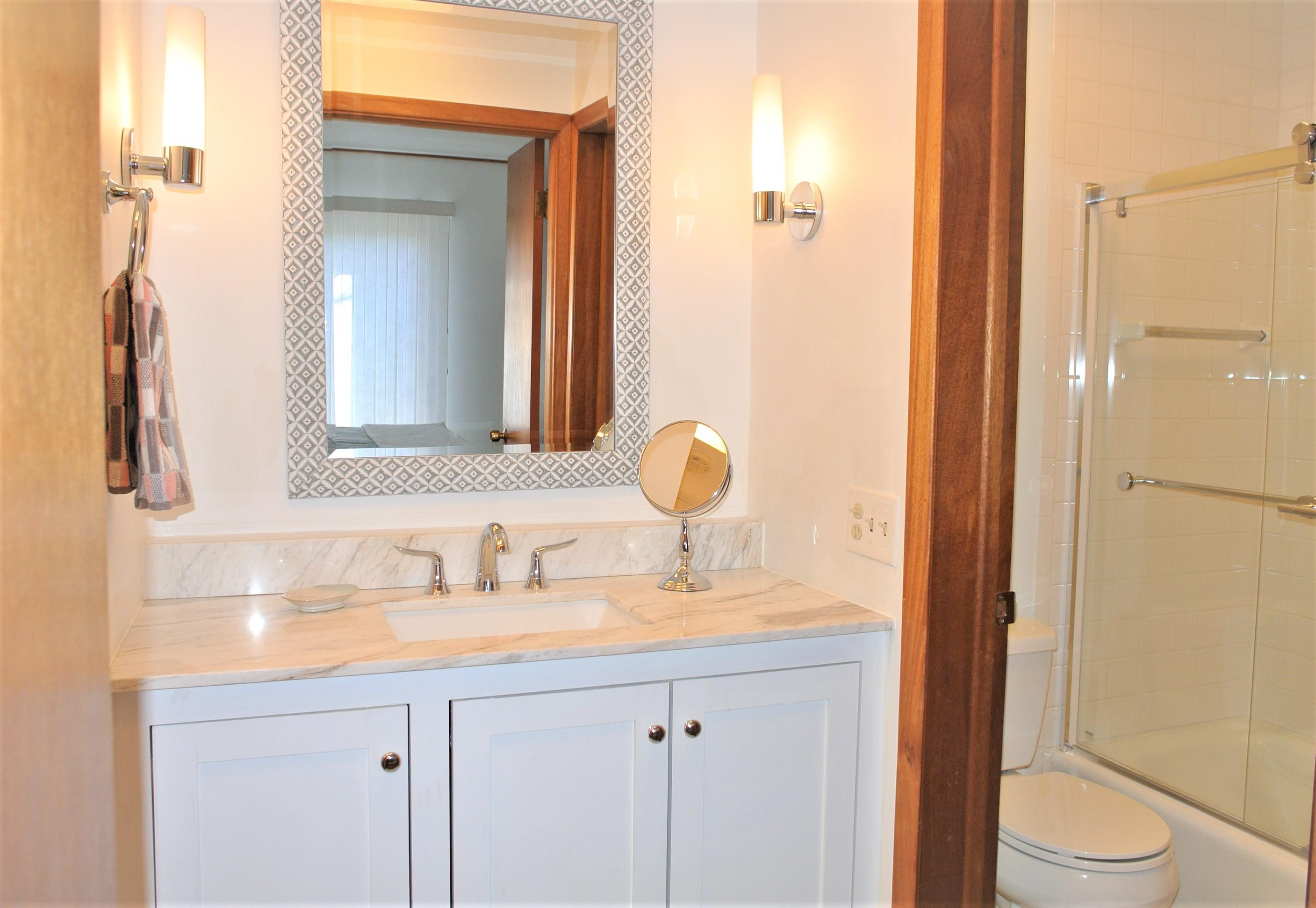 163 Greensward Road Mashpee, MA 02649 - Photo 14 of 37 a bathroom with a sink and a mirror