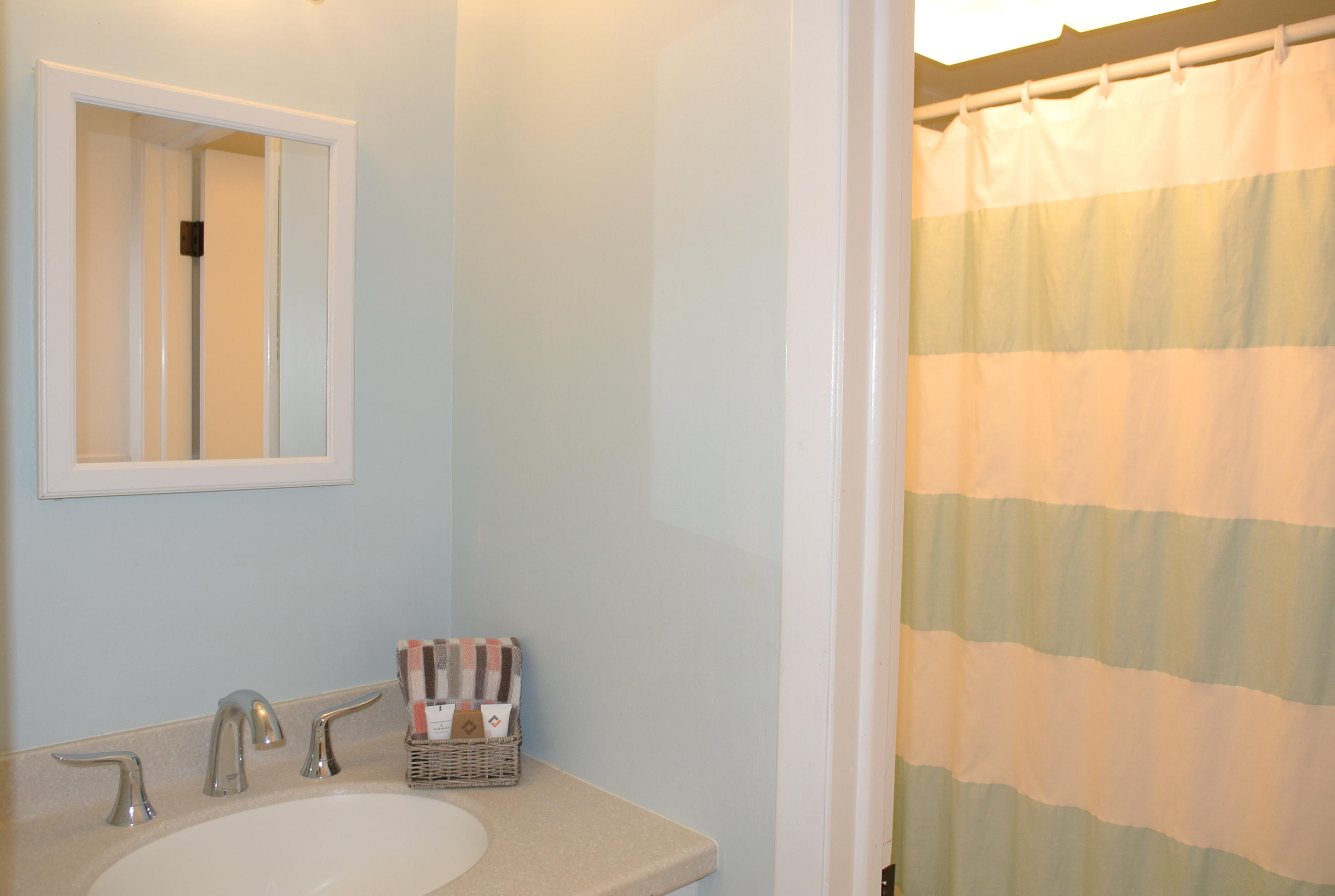 163 Greensward Road Mashpee, MA 02649 - Photo 16 of 37 a bathroom with a sink and a mirror
