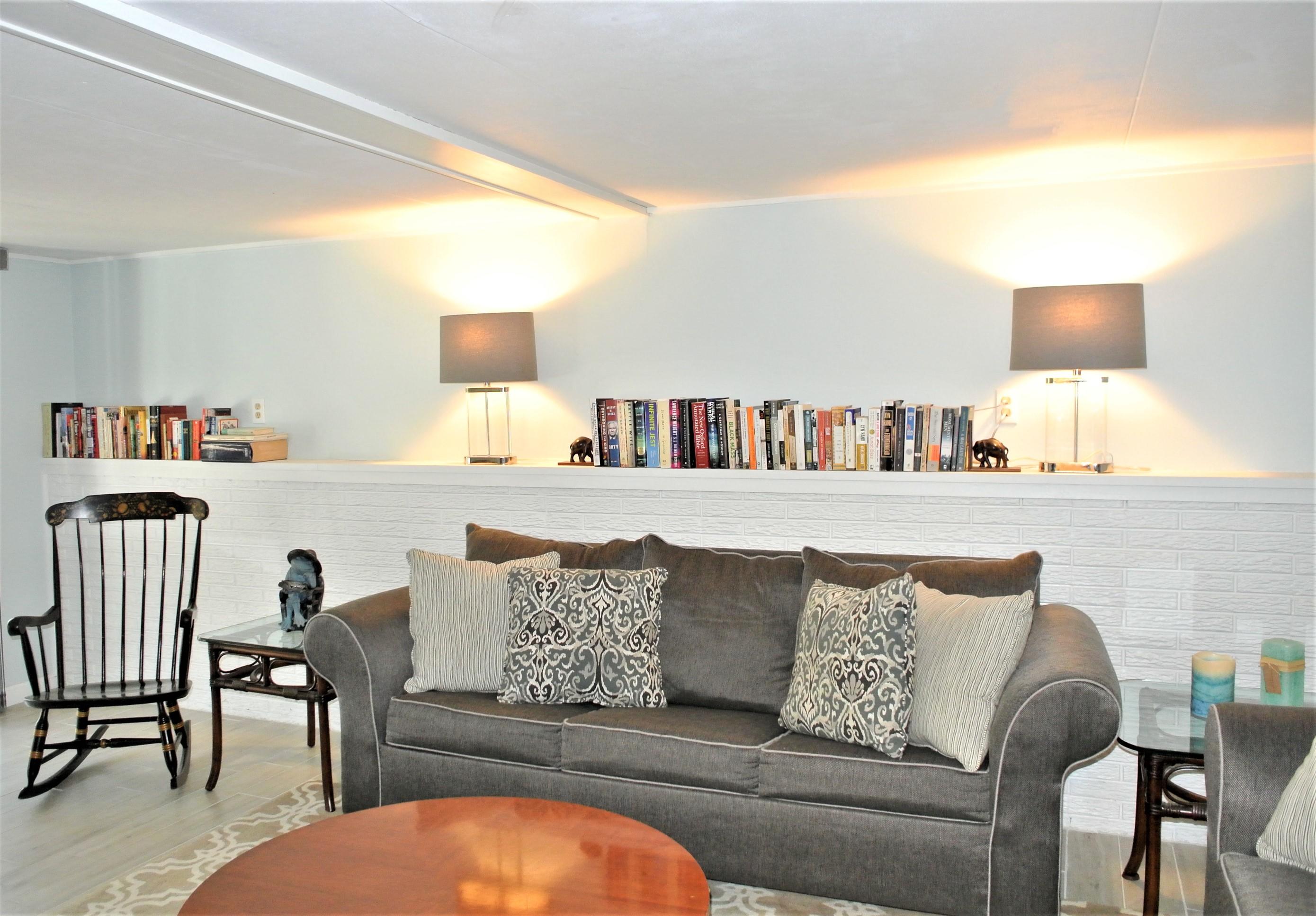 163 Greensward Road Mashpee, MA 02649 - Photo 21 of 37 a living room with furniture and flat screen tv