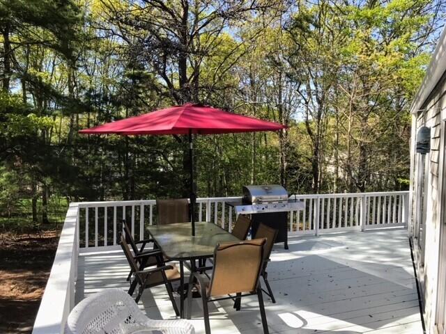 163 Greensward Road Mashpee, MA 02649 - Photo 24 of 37 a view of backyard with outdoor seating and trees