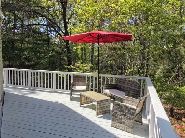 163 Greensward Road Mashpee, MA 02649 - Photo 26 of 37 a view of balcony with wooden floor and outdoor seating