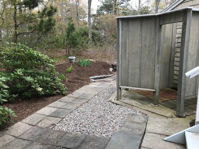 163 Greensward Road Mashpee, MA 02649 - Photo 31 of 37 a backyard of a house with lots of green space