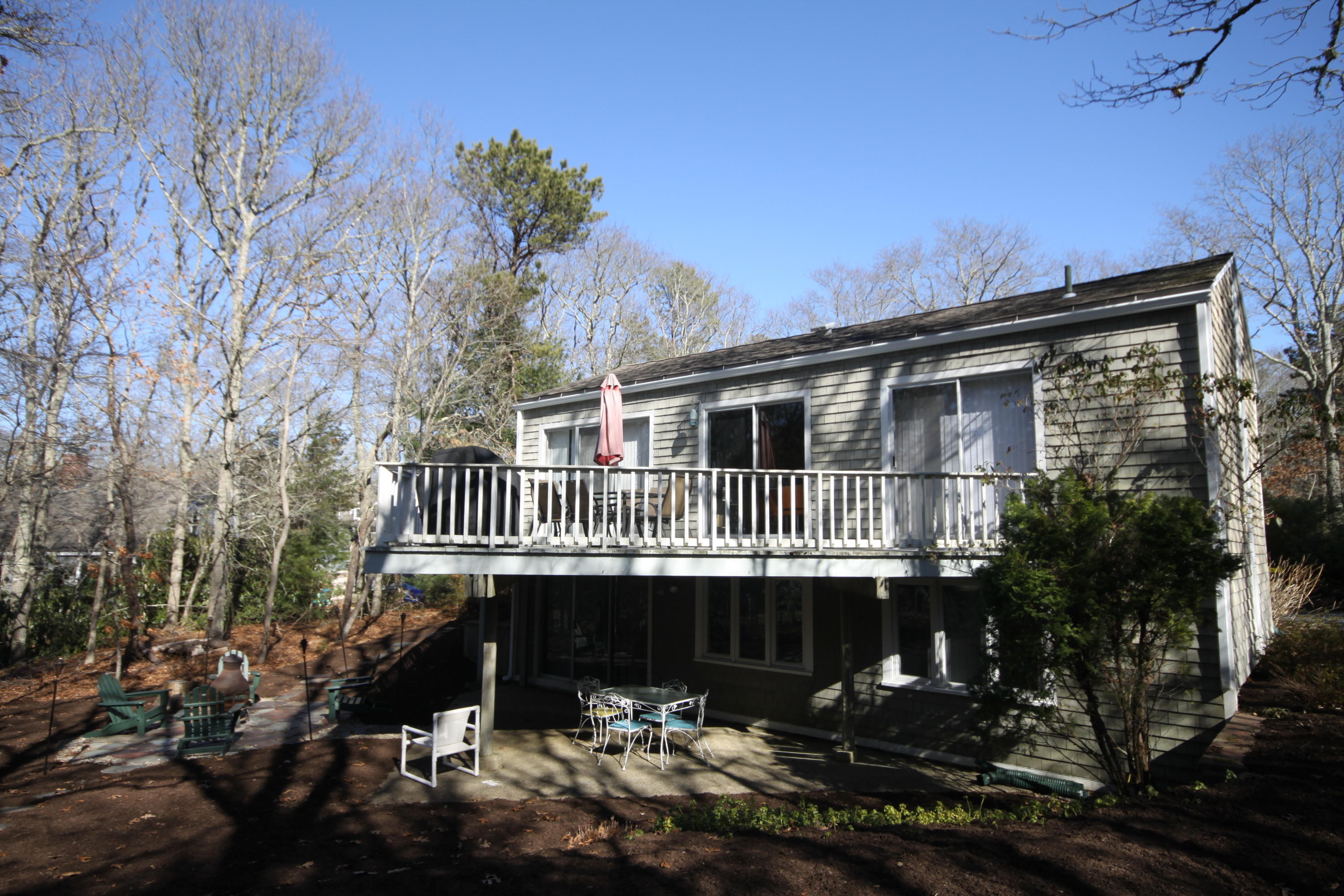 163 Greensward Road Mashpee, MA 02649 - Photo 33 of 37 a view of a house with a yard