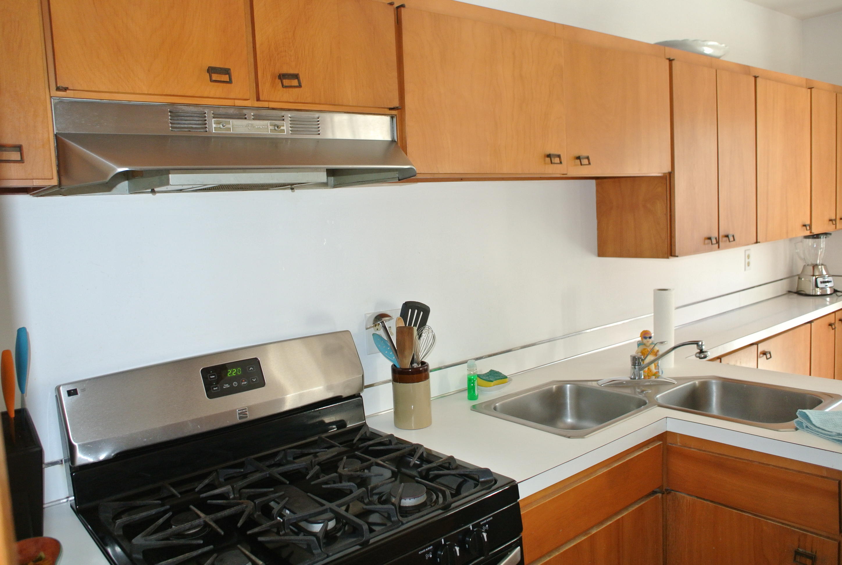 163 Greensward Road Mashpee, MA 02649 - Photo 5 of 37 a kitchen with a sink and a stove top oven