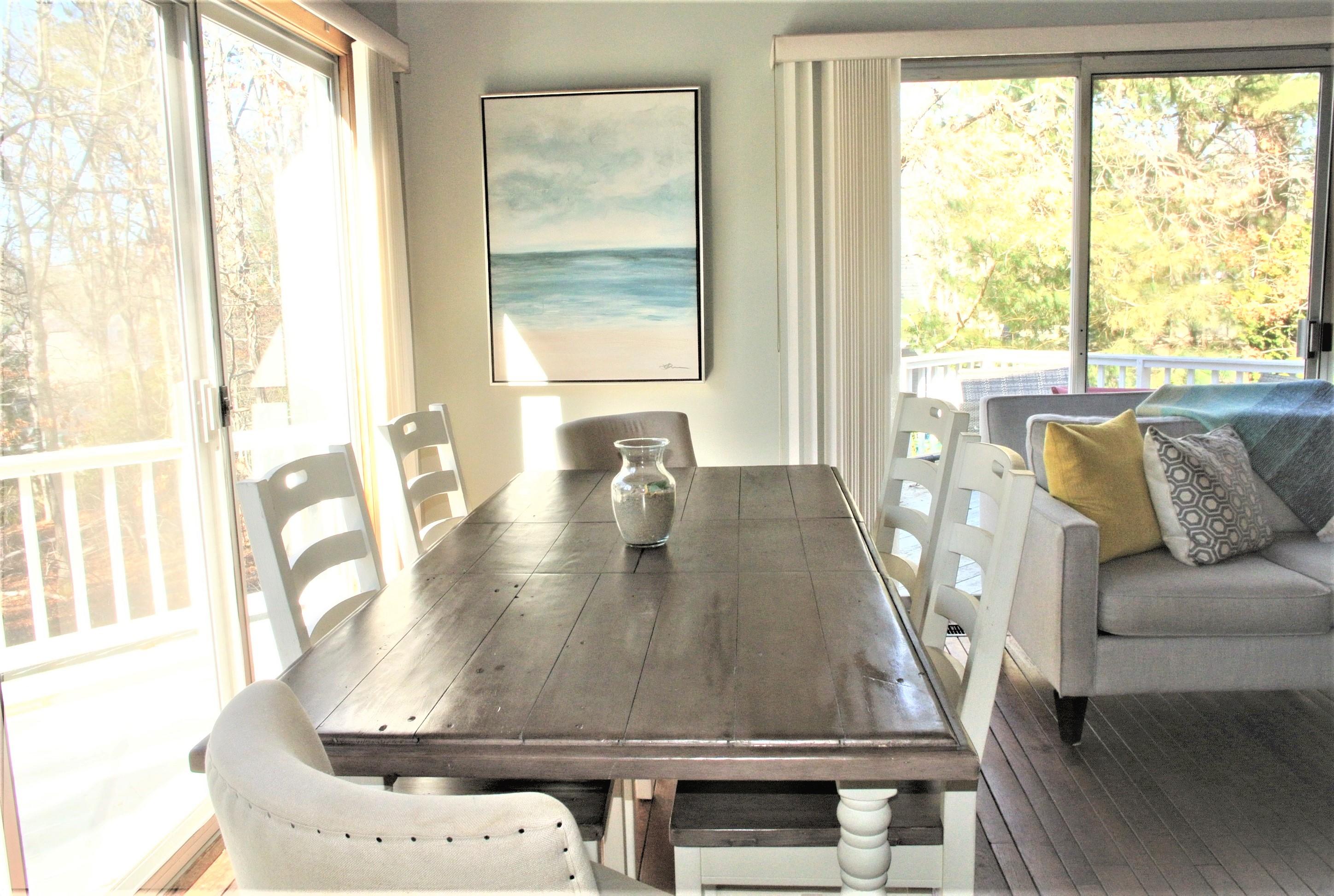 163 Greensward Road Mashpee, MA 02649 - Photo 9 of 37 a view of a dining room with furniture and a window