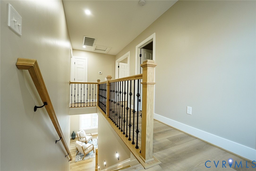 2328 Pocoshock Boulevard North Chesterfield, VA 23235 - Photo 15 of 29 a view of a hallway with wooden floor and entryway