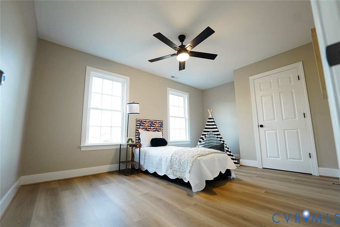 2328 Pocoshock Boulevard North Chesterfield, VA 23235 - Photo 17 of 29 a spacious bedroom with a bed and a window