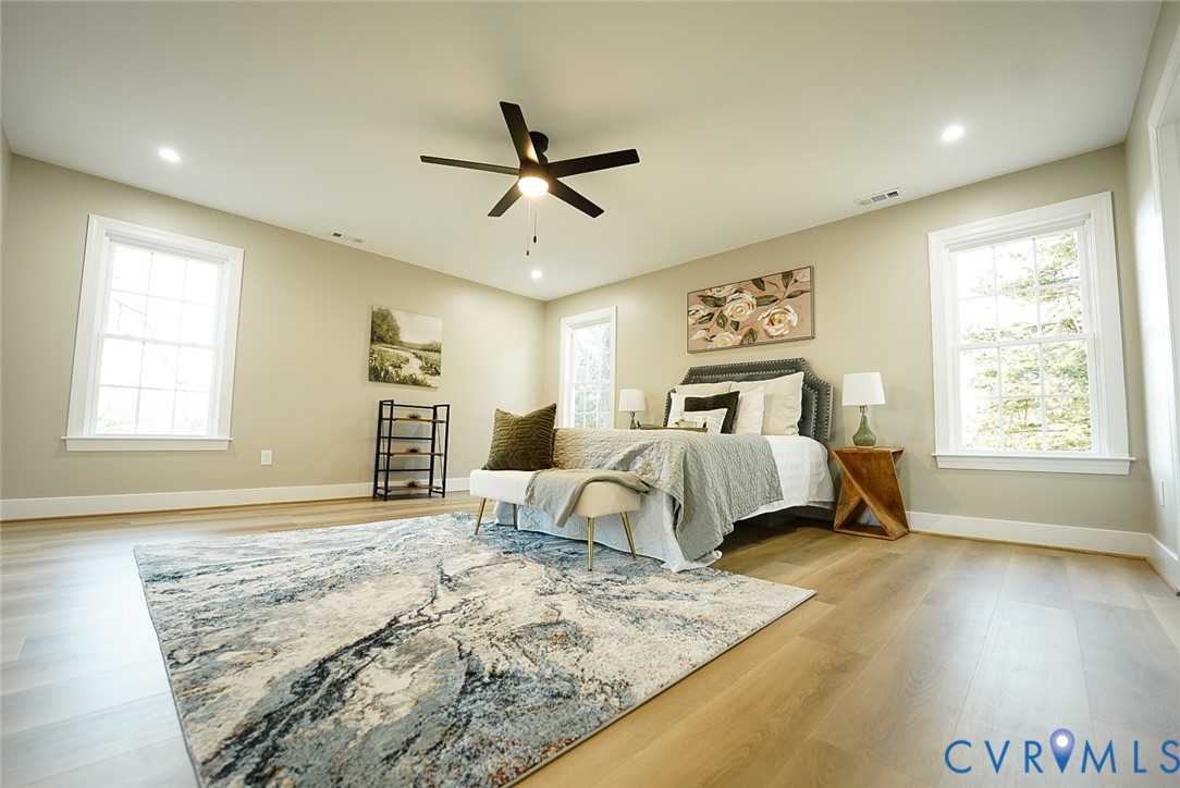 2328 Pocoshock Boulevard North Chesterfield, VA 23235 - Photo 21 of 29 a bedroom with a bed and wooden floor