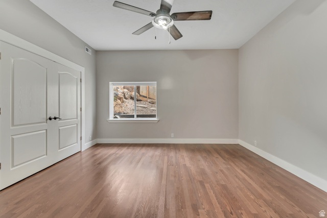 2154 Wasatch Boulevard Sandy, UT 84092 - Photo 38 of 55 Unfurnished bedroom featuring light wood-style floors and a ceiling fan