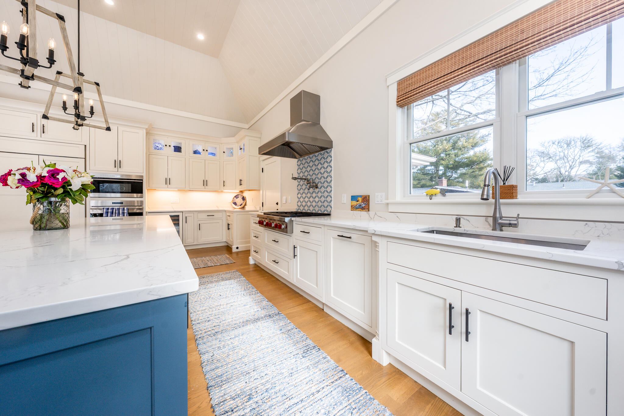 67 Fire Station Road Osterville, MA 02655 - Photo 11 of 53 a kitchen with kitchen island granite countertop a sink cabinets and window