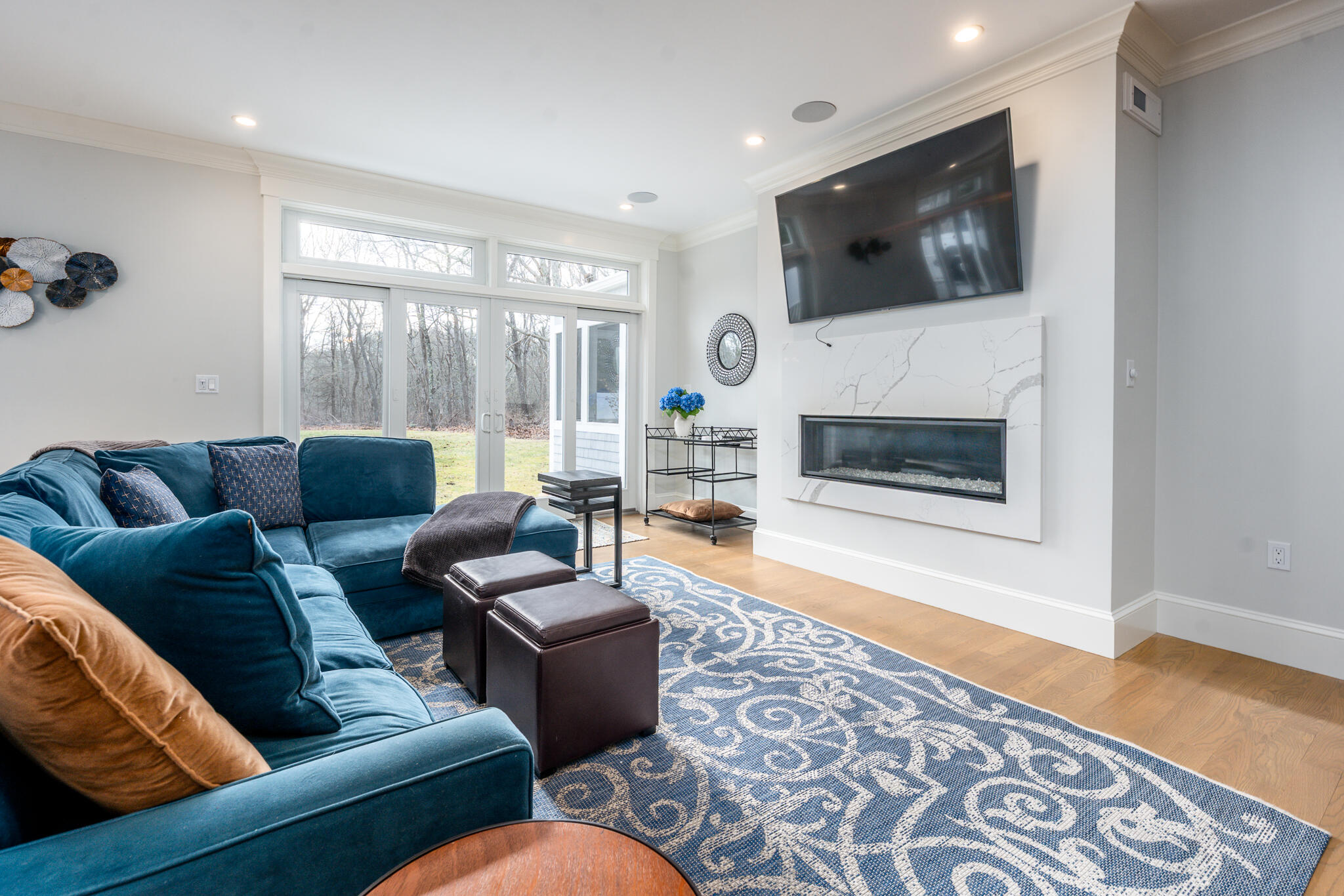 67 Fire Station Road Osterville, MA 02655 - Photo 19 of 53 a living room with furniture a flat screen tv and a fireplace