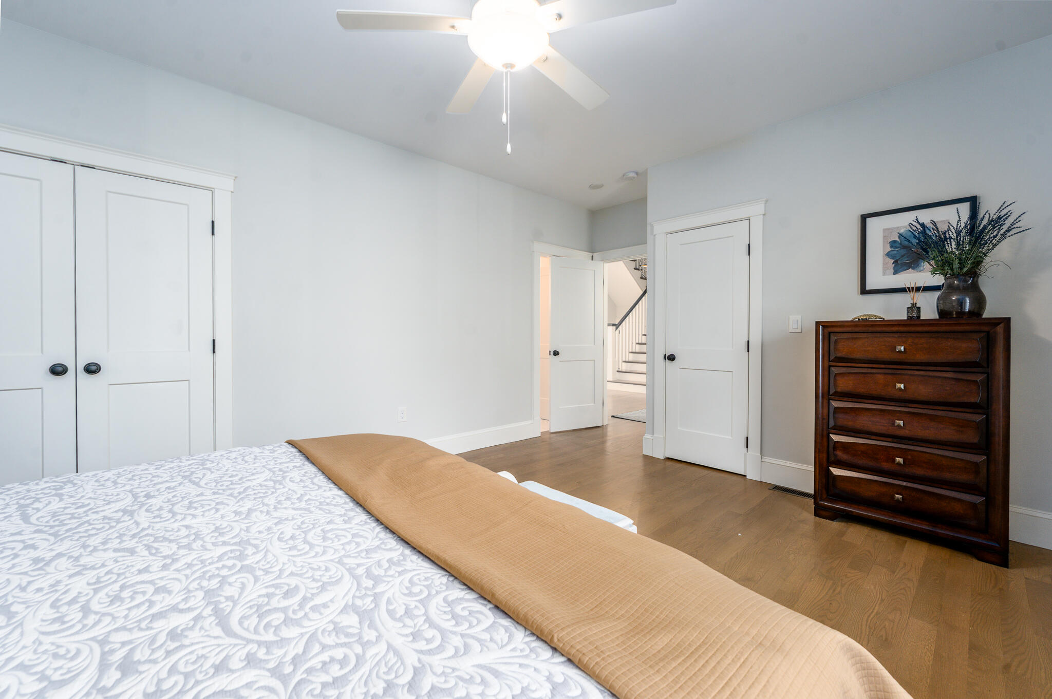 67 Fire Station Road Osterville, MA 02655 - Photo 23 of 53 a bedroom with a bed and a chandelier