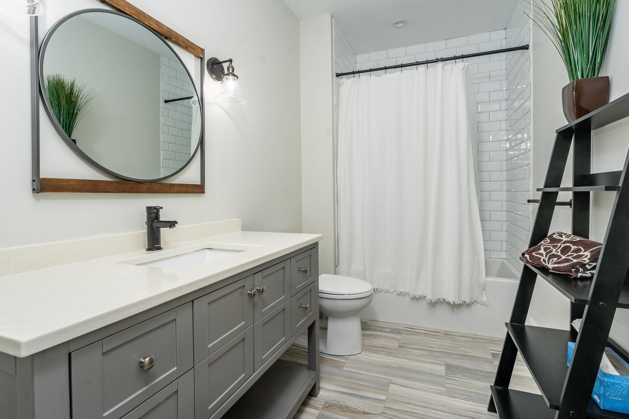 67 Fire Station Road Osterville, MA 02655 - Photo 27 of 53 a bathroom with a sink a mirror a toilet and a window