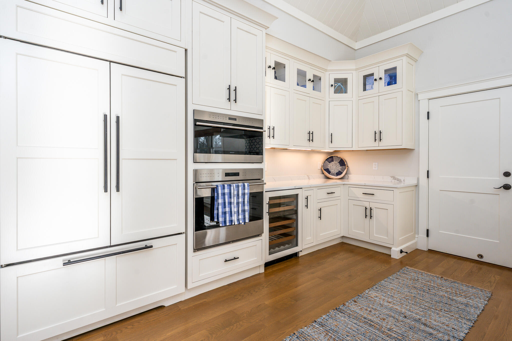 67 Fire Station Road Osterville, MA 02655 - Photo 7 of 53 a kitchen with white cabinets and white appliances