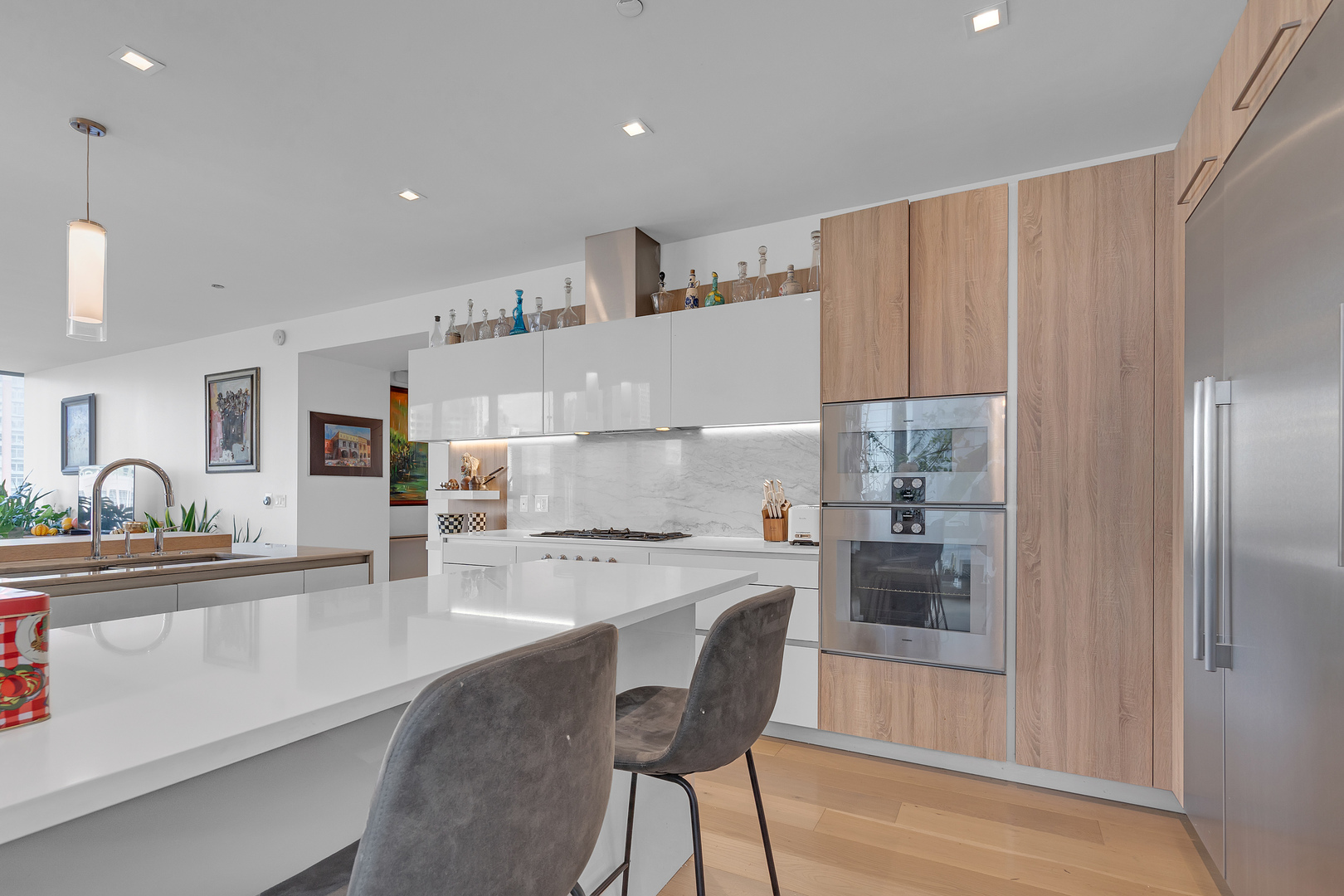 363 East Wacker Drive, Unit 1402 Chicago, IL 60601 - Photo 12 of 75 a kitchen with a dining table chairs and refrigerator