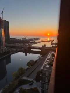 a kitchen with white cabinets and appliances