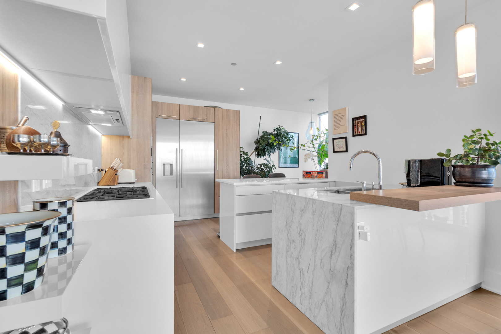 363 East Wacker Drive, Unit 1402 Chicago, IL 60601 - Photo 25 of 75 a kitchen with kitchen island a counter top space a sink stainless steel appliances and cabinets