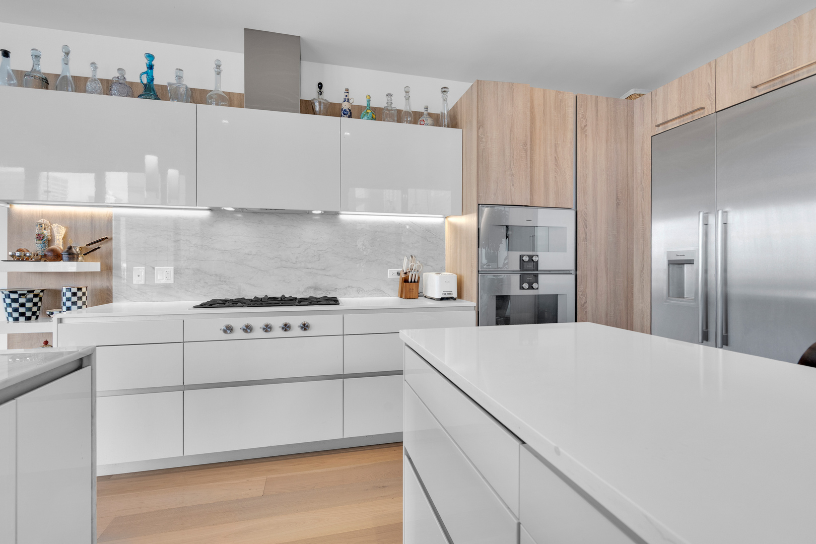 363 East Wacker Drive, Unit 1402 Chicago, IL 60601 - Photo 26 of 75 a kitchen with cabinets appliances and a center island