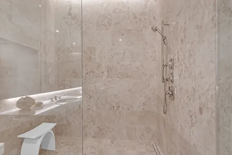 a view of living room with furniture and floor to ceiling window