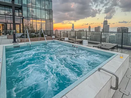 a living room with furniture and a large mirror