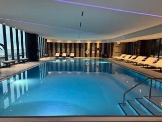 a bathroom with a shower and a glass door