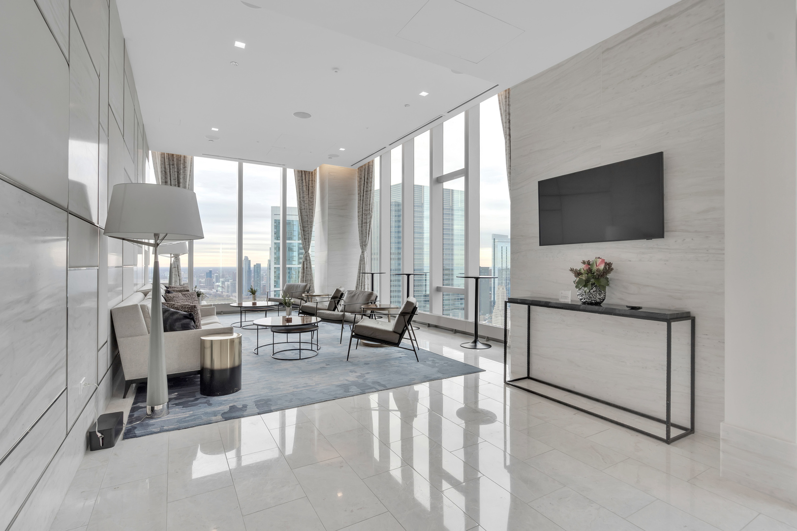 363 East Wacker Drive, Unit 1402 Chicago, IL 60601 - Photo 43 of 75 a living room with furniture a flat screen tv and a large window