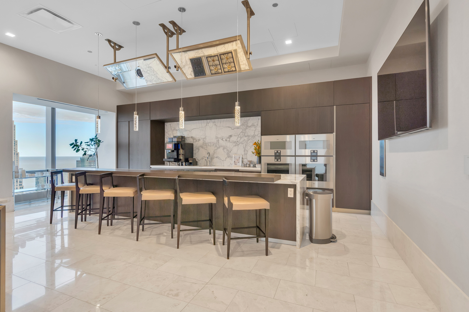 363 East Wacker Drive, Unit 1402 Chicago, IL 60601 - Photo 49 of 75 a dining hall with stainless steel appliances kitchen island granite countertop furniture and a view of kitchen