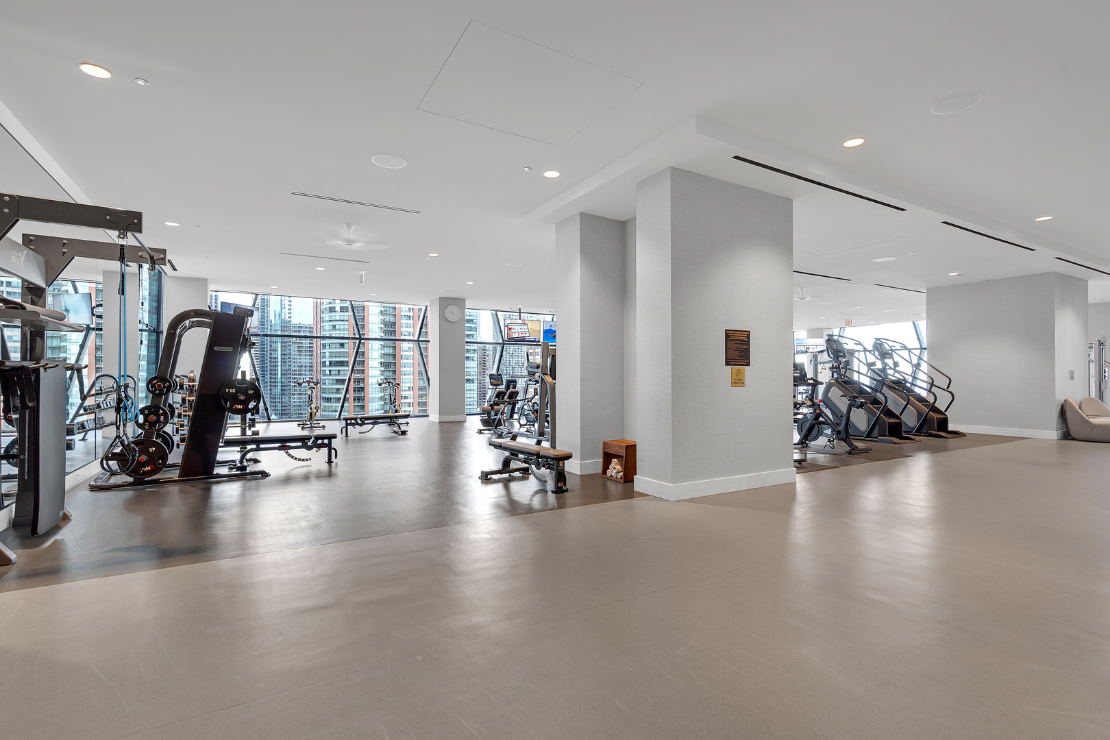 363 East Wacker Drive, Unit 1402 Chicago, IL 60601 - Photo 62 of 75 a view of a room with gym equipment and a large window