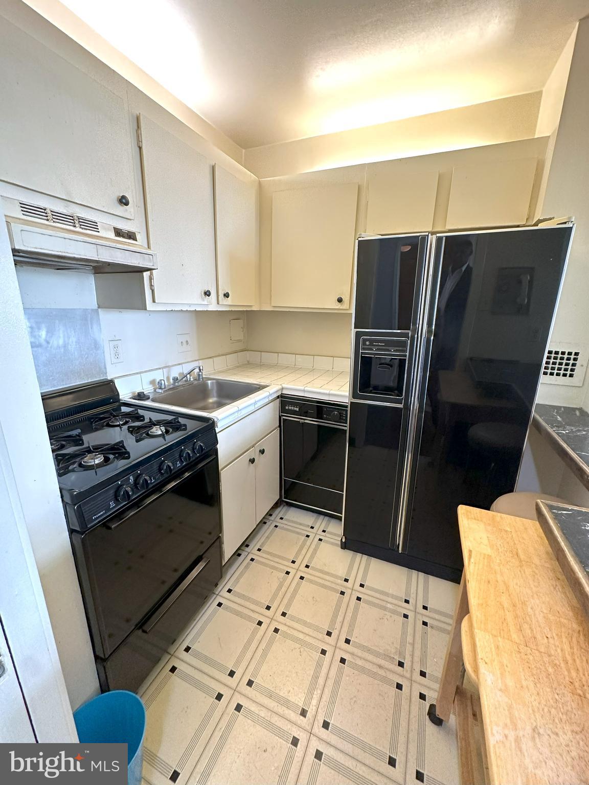 5500 Friendship Boulevard, Unit 1125N Chevy Chase, MD 20815 - Photo 7 of 48 a kitchen with stainless steel appliances a stove a sink and a refrigerator