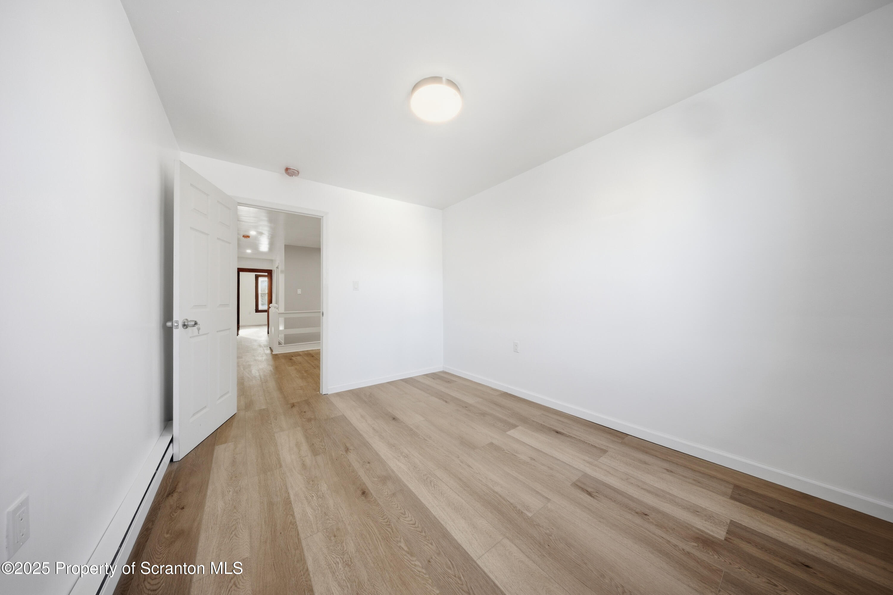 1312-14 North Washington Avenue Scranton, PA 18509 - Photo 15 of 22 a view of a room with wooden floor and a sink