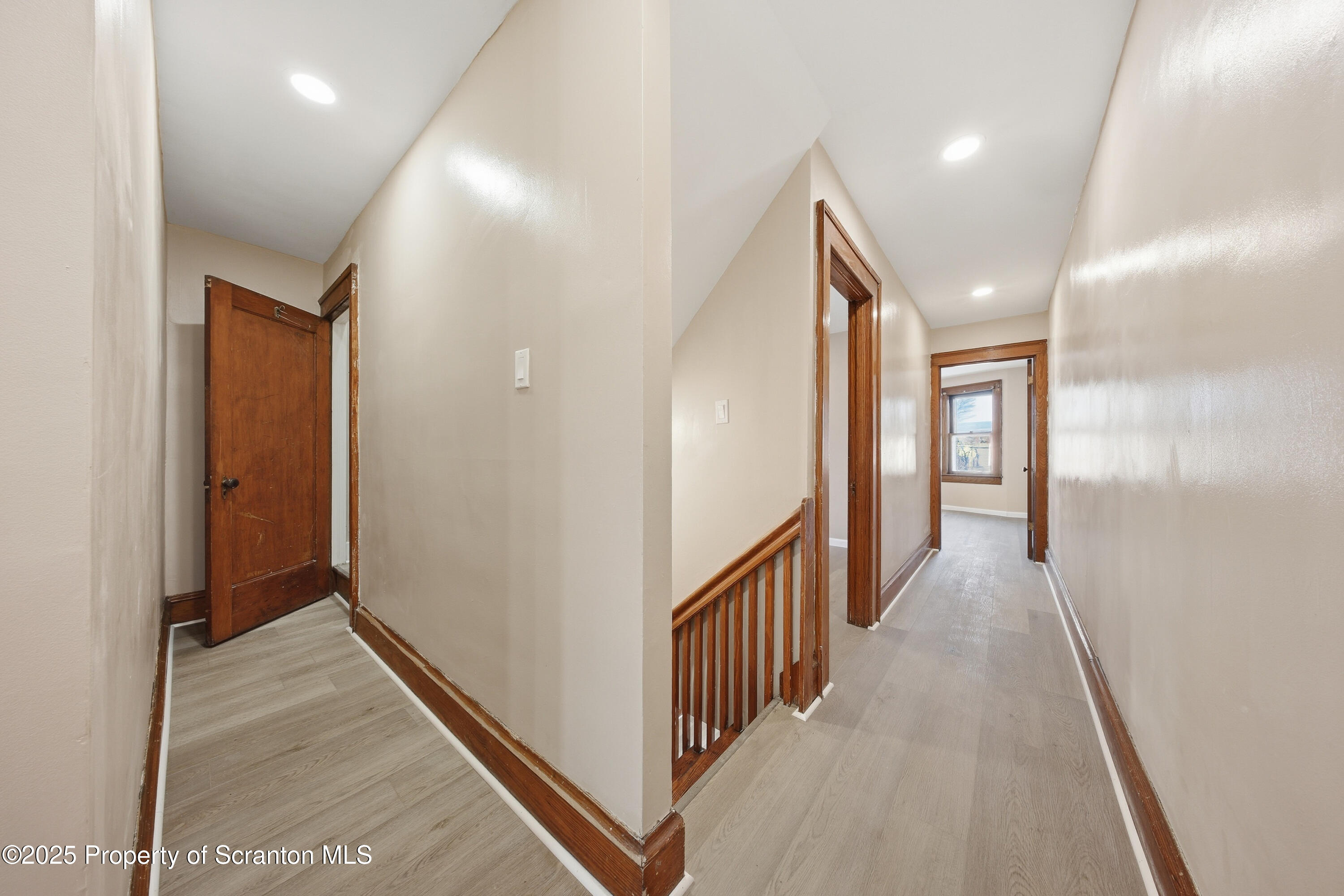 1312-14 North Washington Avenue Scranton, PA 18509 - Photo 21 of 22 a view of a hallway with wooden floor and staircase