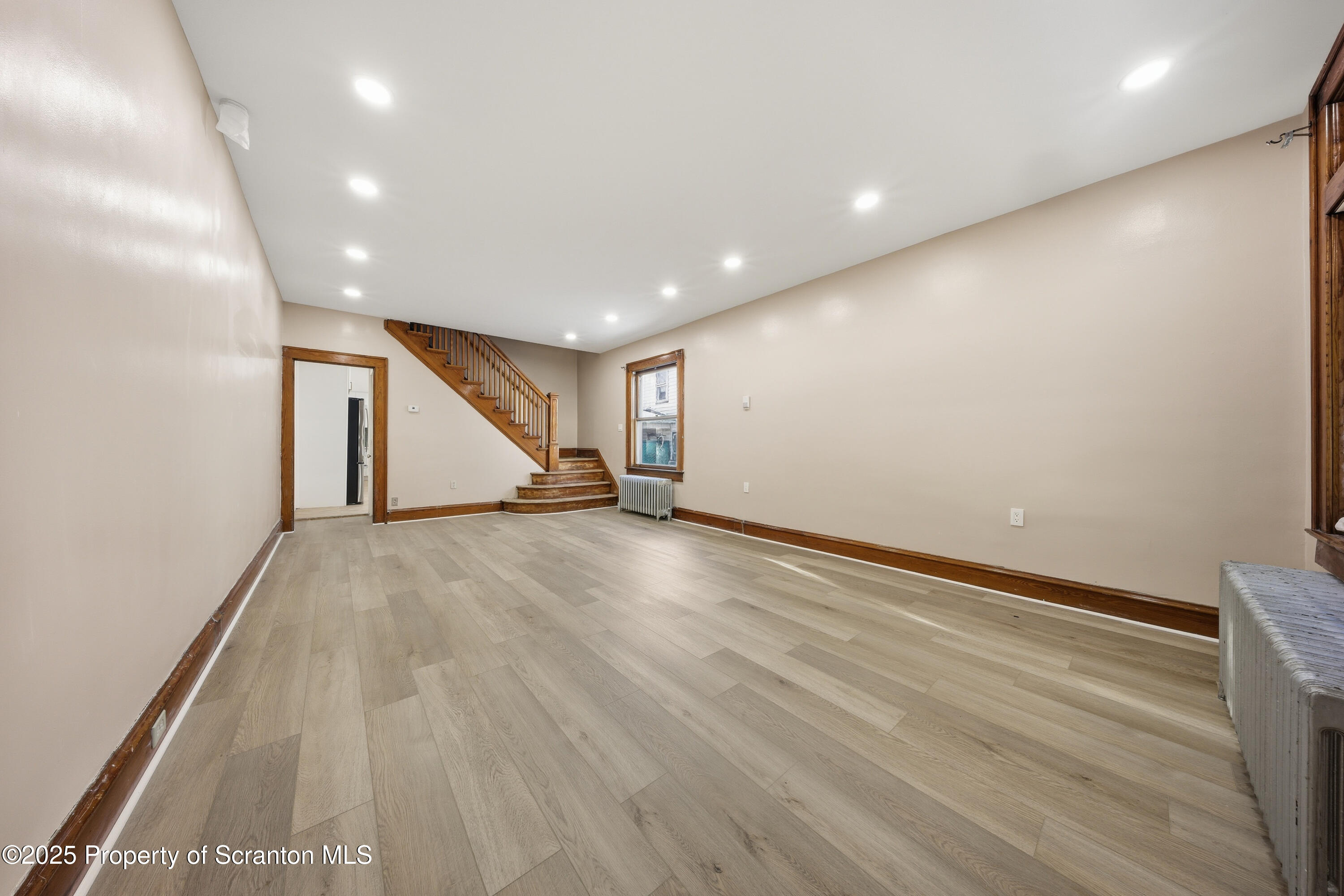 1312-14 North Washington Avenue Scranton, PA 18509 - Photo 3 of 22 a view of an empty room with wooden floor