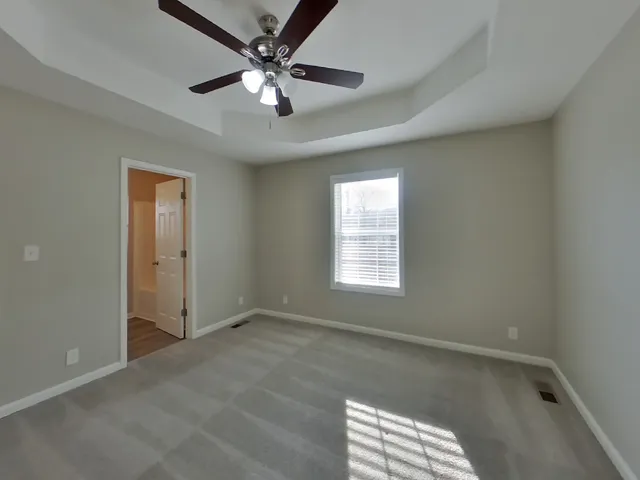 a view of an empty room with a window