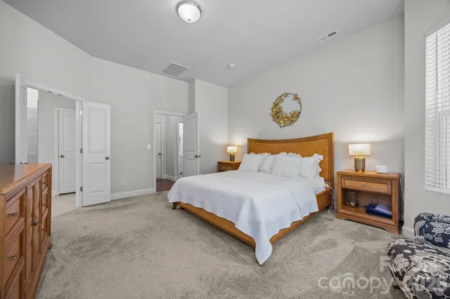 a bathroom with double sink and a mirror