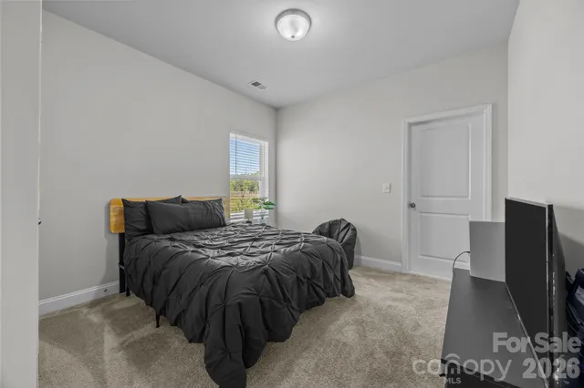 a en suite bathroom with double sink and a mirror