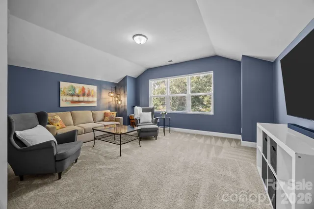 a front view of a house with a yard table and chairs