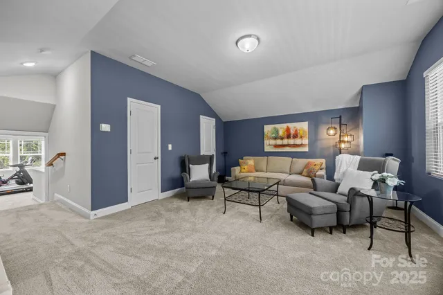 a living room with furniture and a table