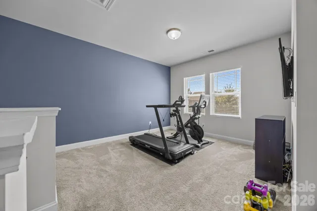 a living room with furniture and windows