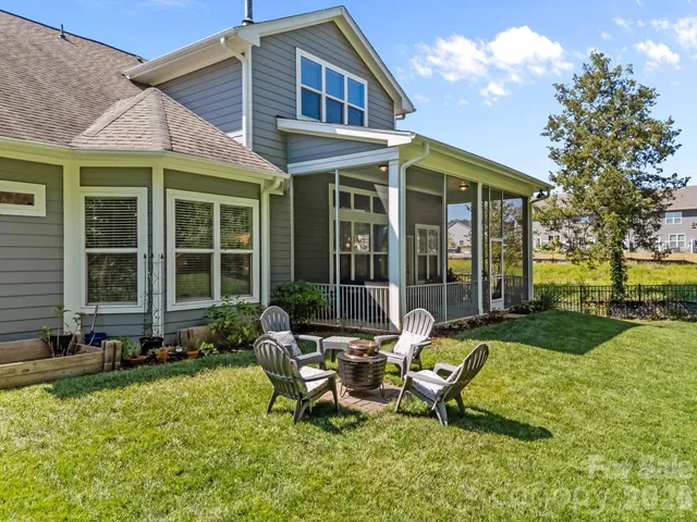 an aerial view of a house with outdoor space