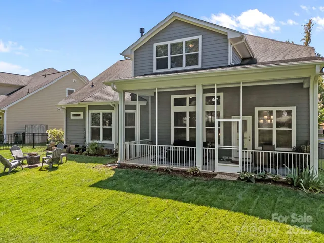 a front view of a house with a yard table and chairs