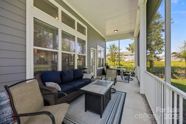 a balcony with furniture and outdoor view