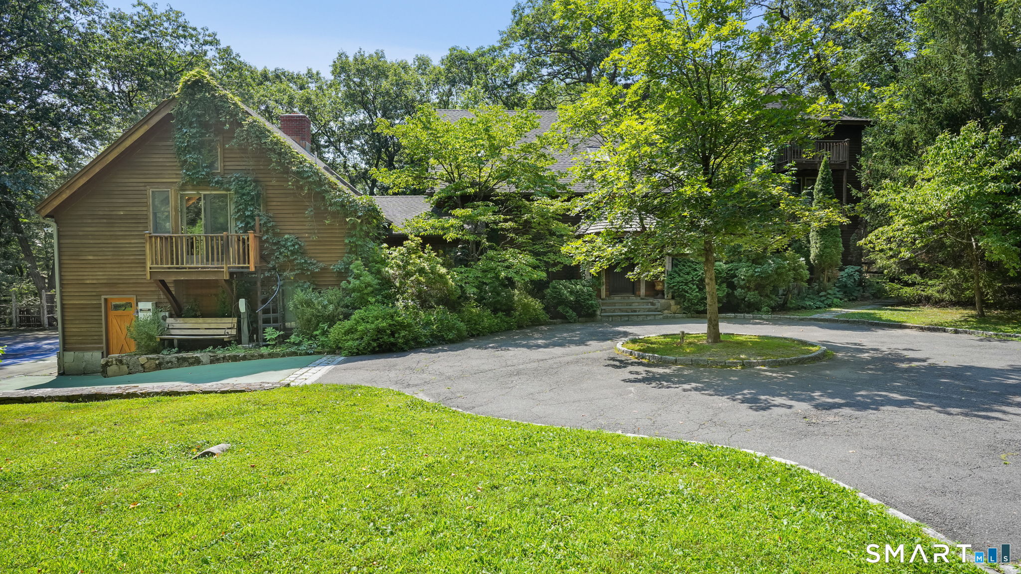 142 Seventy Acre Road Redding, CT 06896 - Photo 2 of 40 front view of a house with a yard