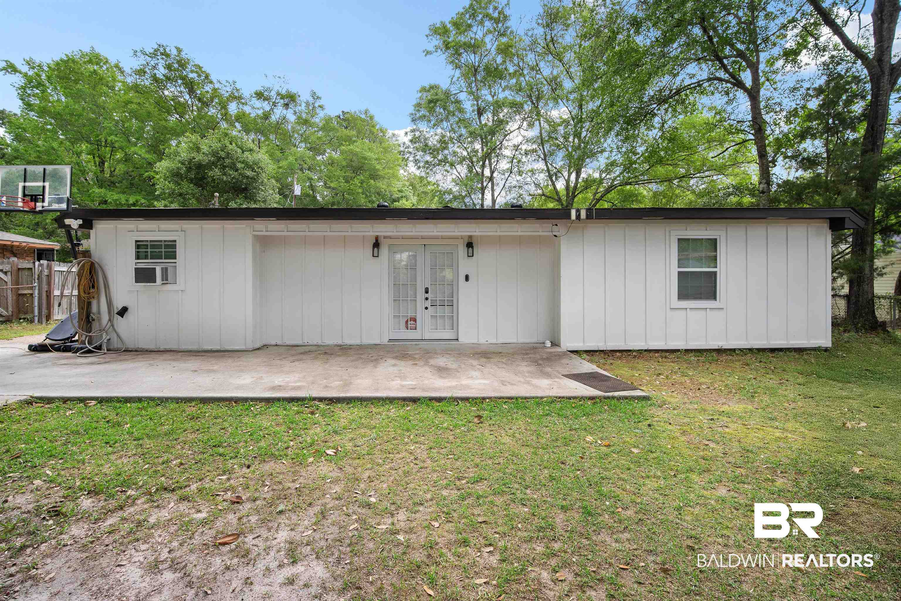 1451 West Morlee Drive Mobile, AL 36618 - Photo 27 of 30 Rear view of house featuring french doors, a patio area, a lawn, and fence