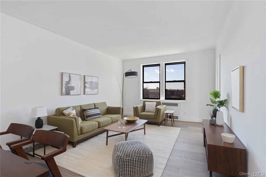 40-35 Ithaca Street, Unit 6F Queens, NY 11373 - Photo 2 of 10 a living room with furniture and a window