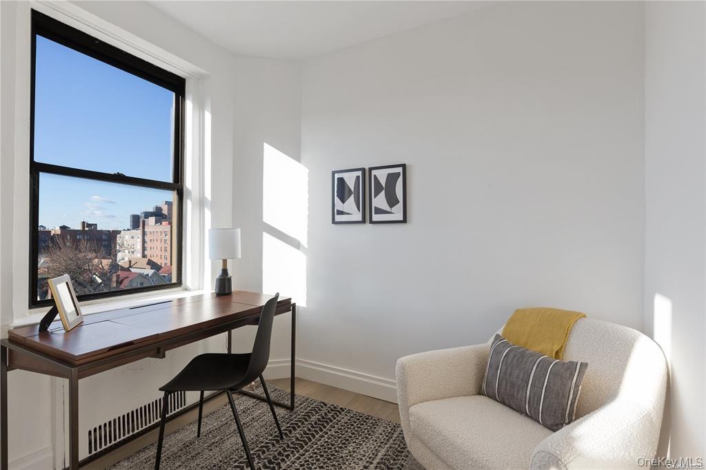 40-35 Ithaca Street, Unit 6F Queens, NY 11373 - Photo 7 of 10 a living room with furniture and a window