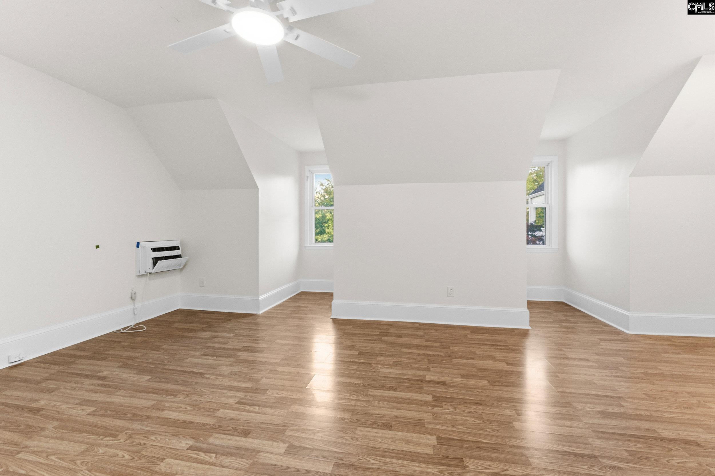 121 Silver Lake Road East Columbia, SC 29223 - Photo 25 of 57 an empty room with wooden floor and windows