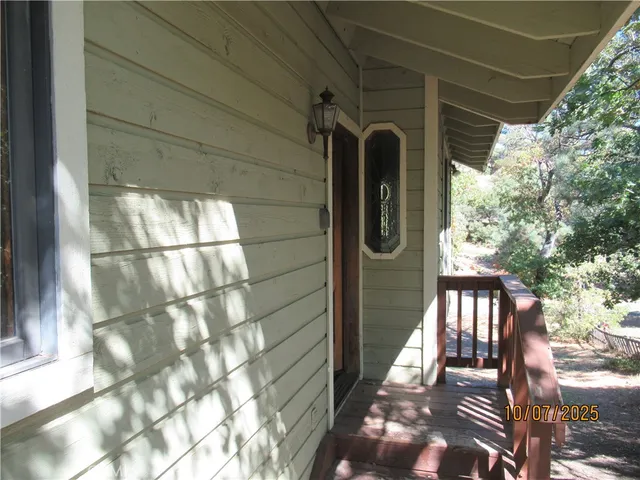a view of a porch with a bench